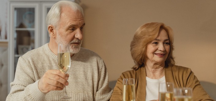 old couple drinking champagne