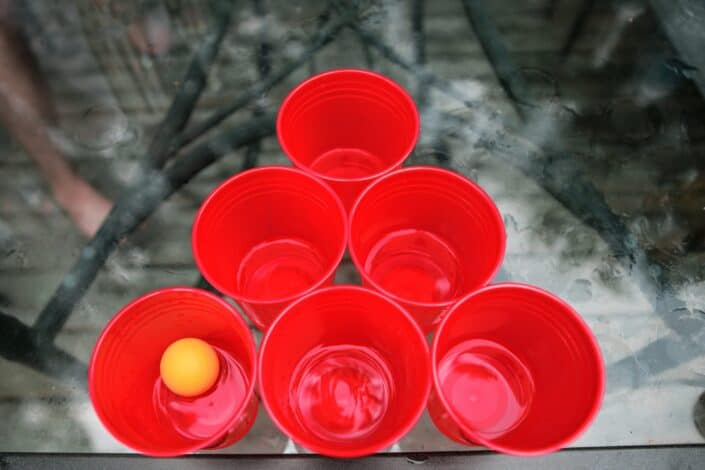 red plastic cups with a ping pong ball