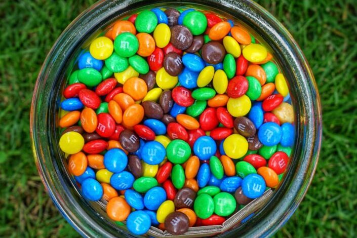 M&Ms on a glass container