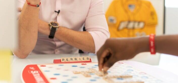two people playing scrabble