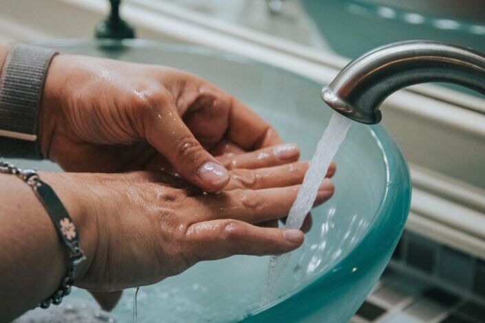 washing hand in a raised sink