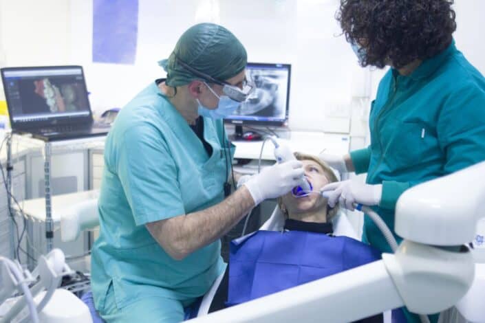 dentist and assistant doing a dental procedure