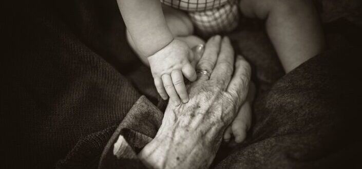 grandmother holding her grandchild 