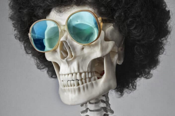 A Skeleton in Sunglasses and Wig