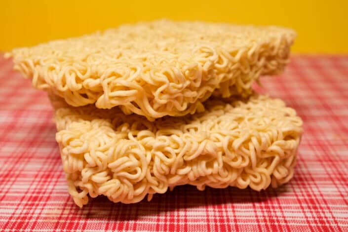 Uncooked dried noodles placed on table