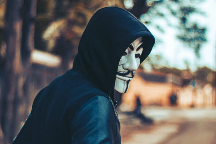 Man Wearing Hoodie and Mask outside