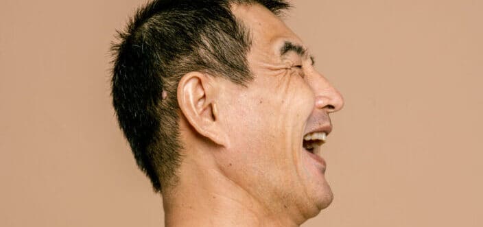 Side View of a Laughing Man