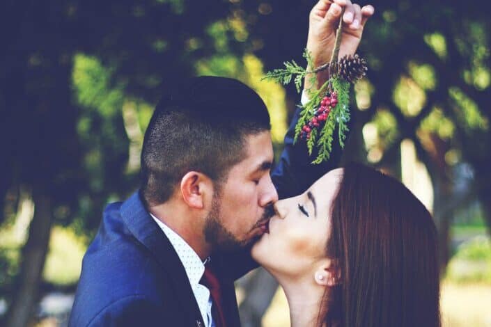Couple Kissing Under a Mistletoe