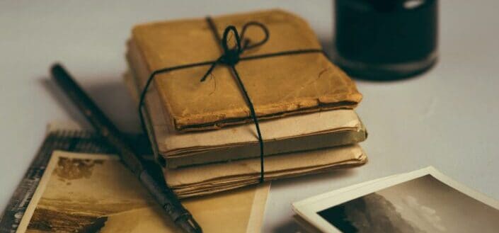 Brown notebooks tied with a black string together