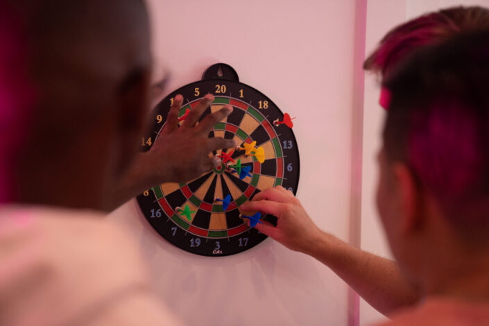 Group Of Friends Playing Darts