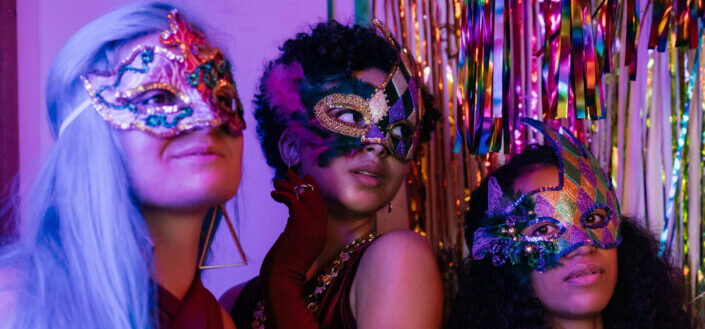 Three women wearing masks