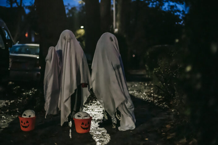 Two people dressed as ghosts