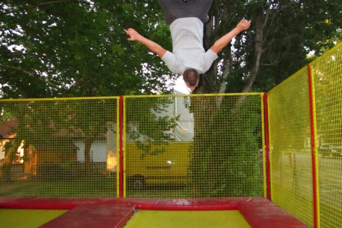man doing a flip on trampoline