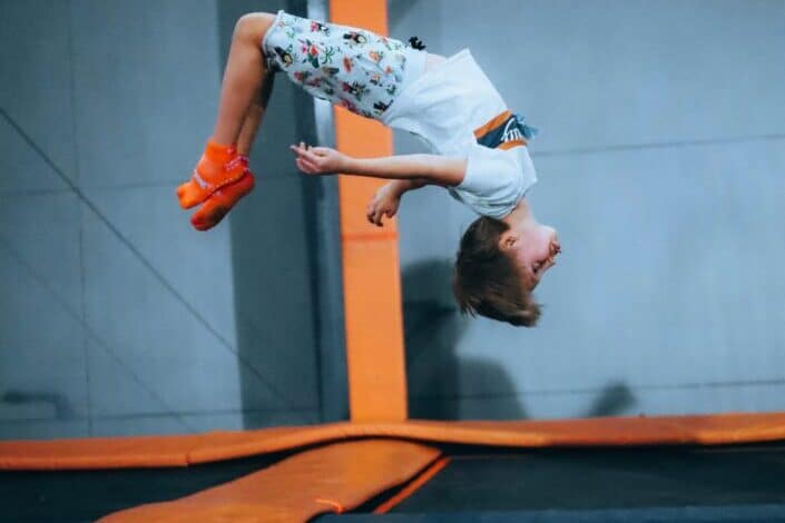 kid doing backflips from trampoline