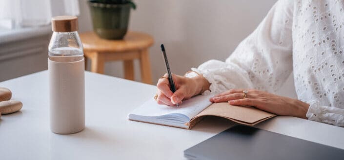 Woman Writing on Her Journal