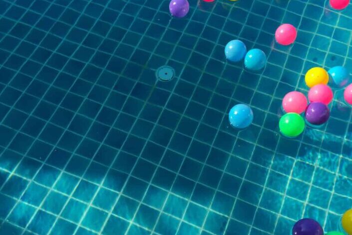 Assorted color balls floating on water
