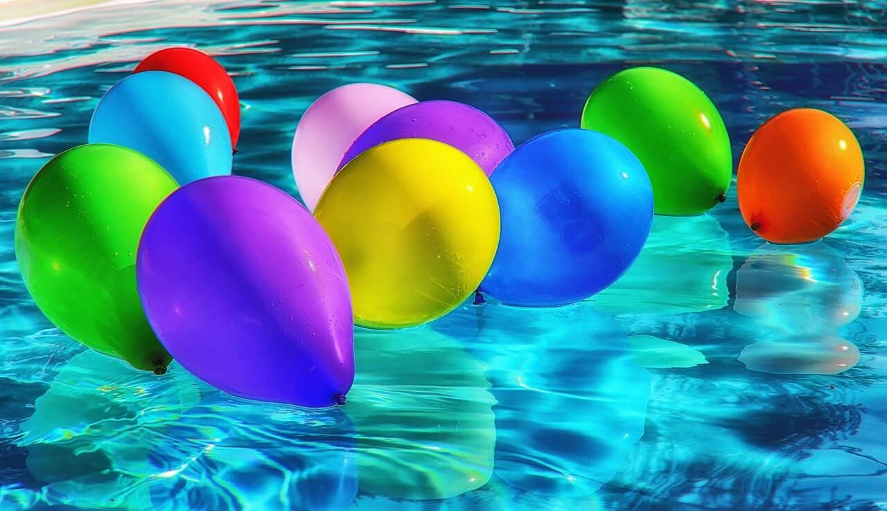 colorful balloons floating on swimming pool