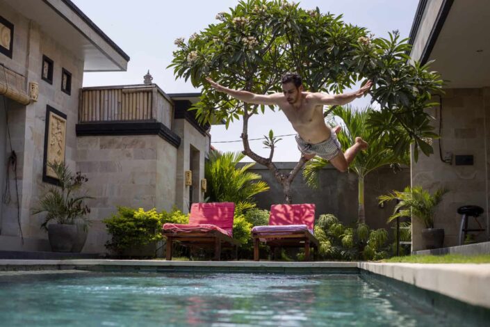 Man jumping into pool
