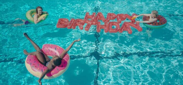 happy birthday being spelled in pool